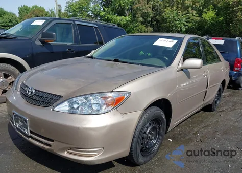 2002 Toyota Camry Le z USA, uszkodzony, nr VIN 4T1BE32K92U092811